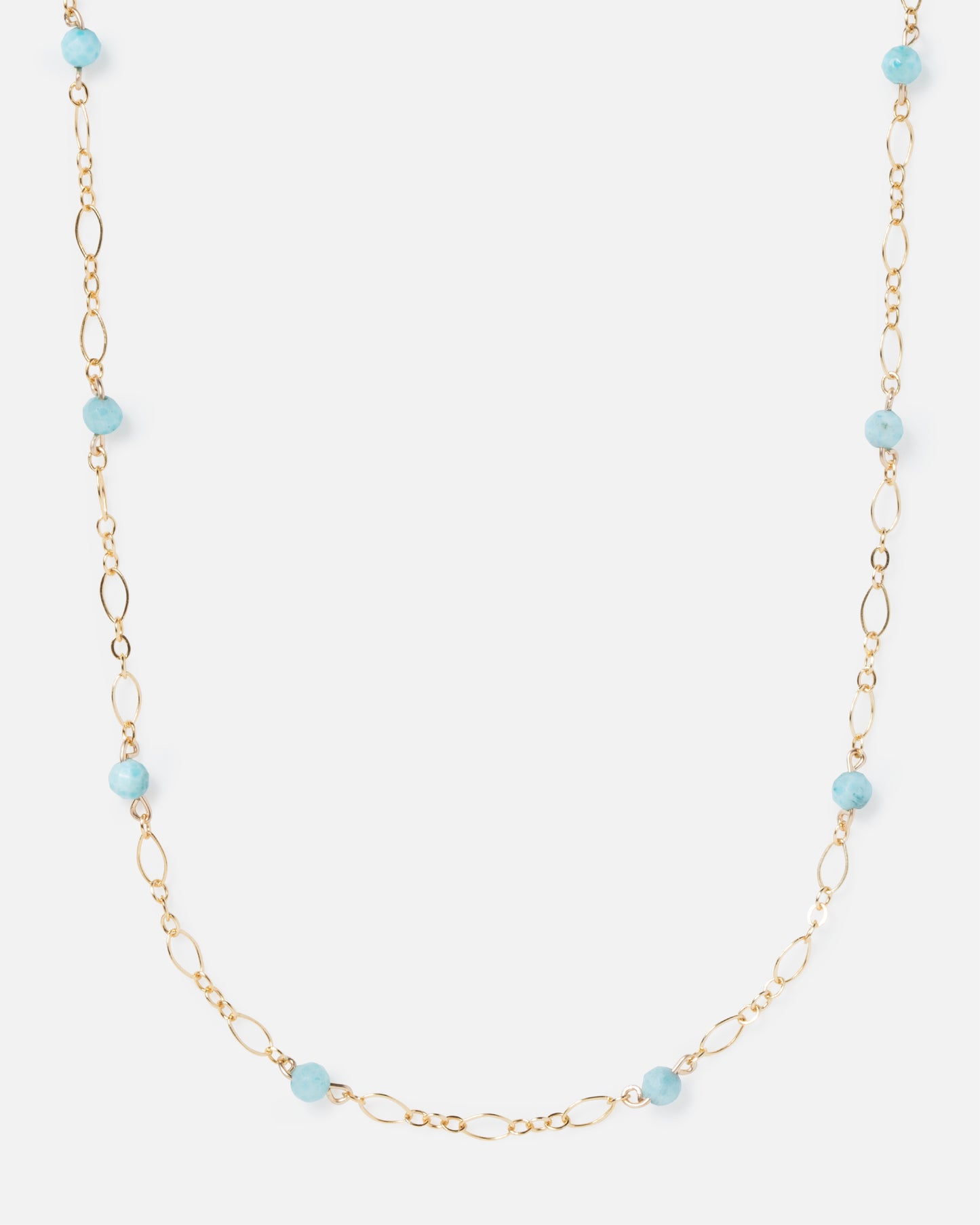 larimar gemstones on fancy gold necklace
