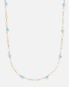 larimar gemstones on fancy gold necklace