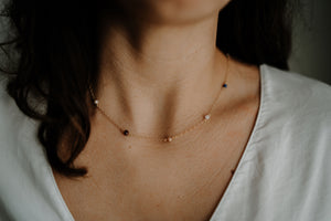 multi-gemstone necklace on girl