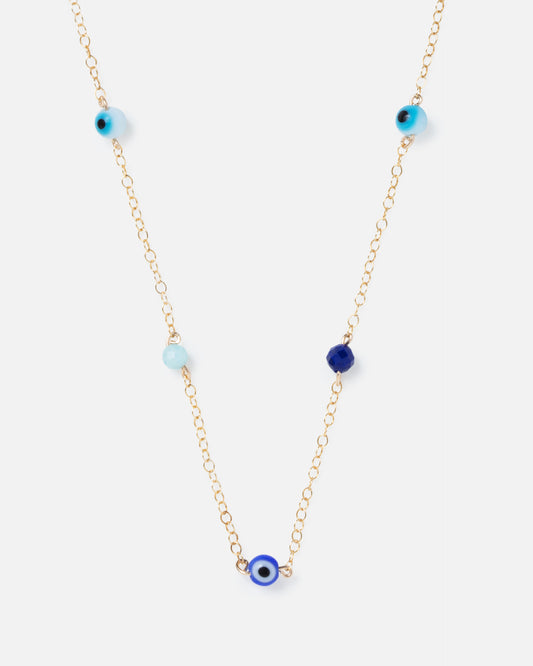 evil eye and blue gemstones on a gold chain