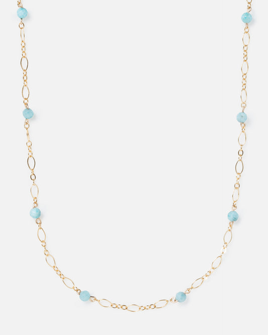 larimar gemstones on fancy gold necklace