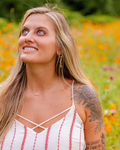 necklace on model in meadow