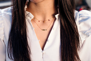 girl wearing bar necklace