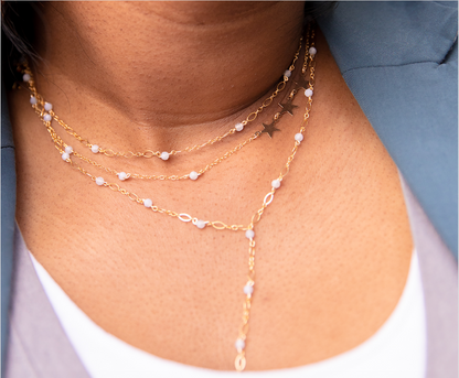 beaded necklace on girl with two other necklaces