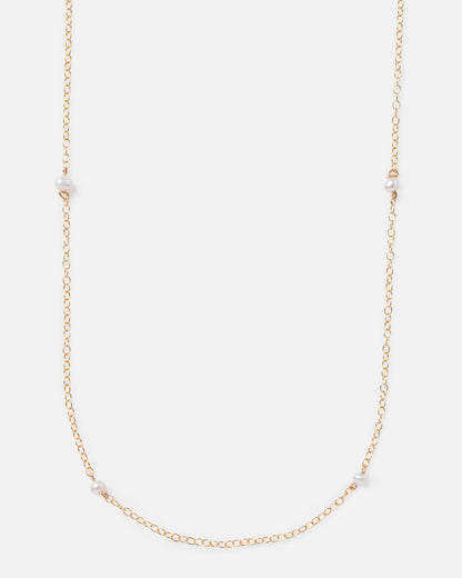 pearl beads on a long gold chain