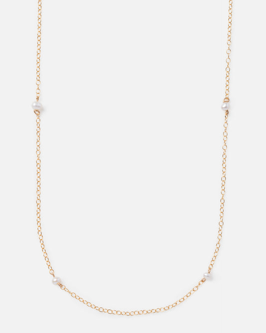 pearl beads on a long gold chain